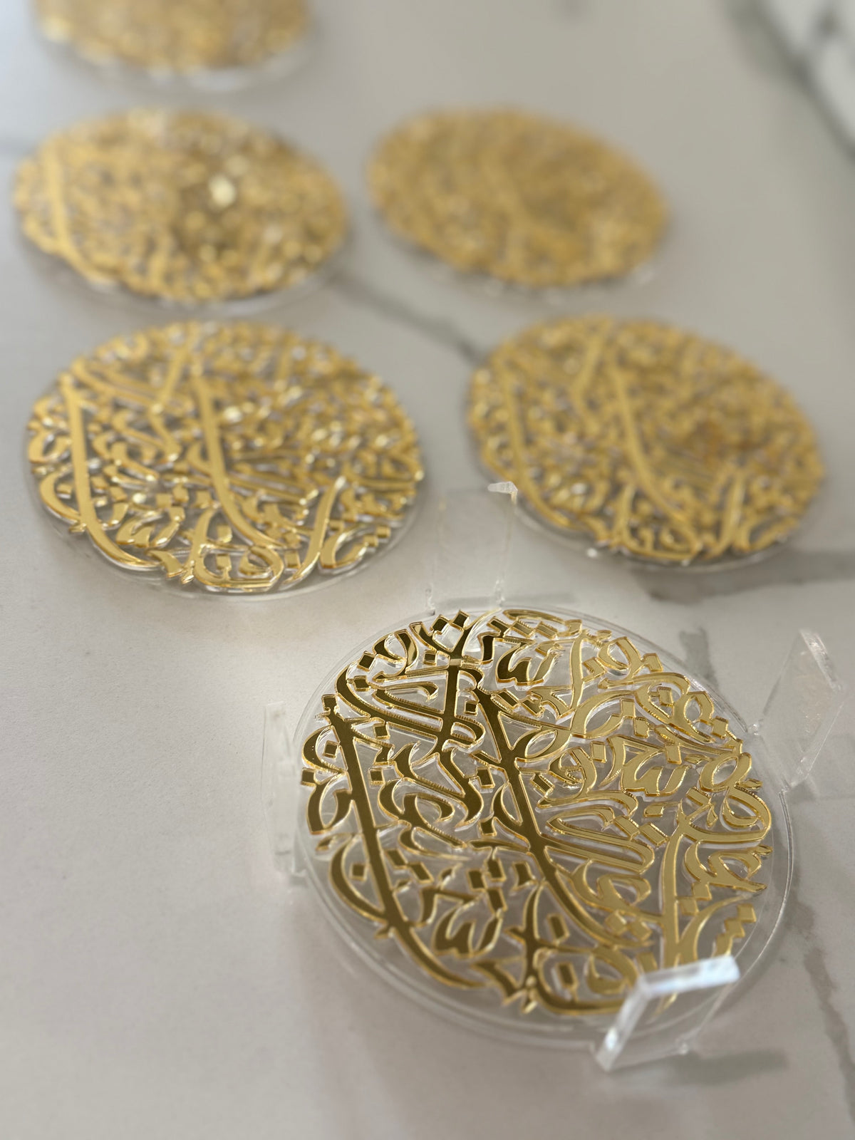 7 pcs Arabic Calligraphy Acrylic Coasters by Khatt By Randa | Black & Gold Set of 6 & Coaster Holder